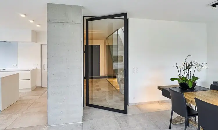 Modern concrete corridor with pivot door